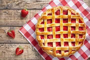 Summer traditional strawberry pie tart cake sweet baked pastry food on rustic wooden table background - obrazy, fototapety, plakaty