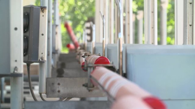 Cars and truck at toll road turnpike, entry fee pay gate, cash money. Barriers are raised and lowered