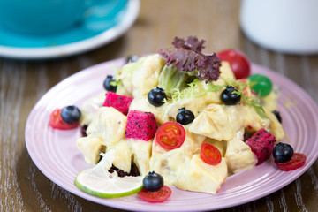 delicious fruit salad on table