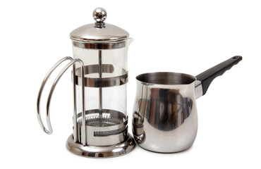 Metal and glass pots for coffee on a white background