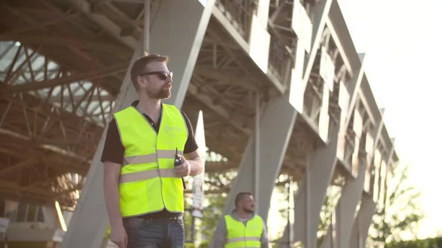 road workers with Traffic rod isolated and walkie talkie work at checkpoint toll roads