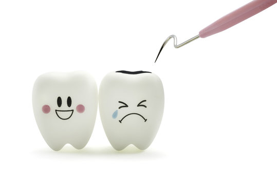 Tooth smile and cry emotion with dental plaque cleaning tool on white background.