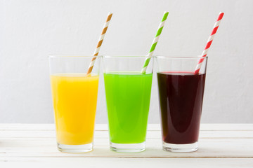 Fresh fruit smoothies on a white wooden background
