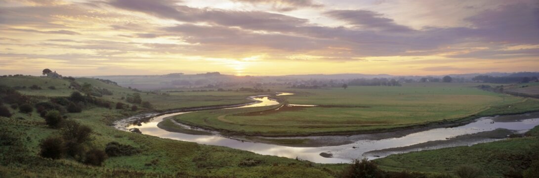 Meandering River Aln at sunset, Foxton, near Alnmouth, Northumberland, UK