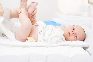 Changing the diaper of a newborn