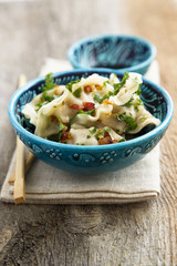 Chinese dumplings with fried onion and soy sauce