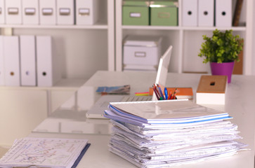 Office desk and a bundle of documents