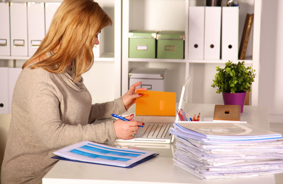 The Woman Behind The Desk In The Office