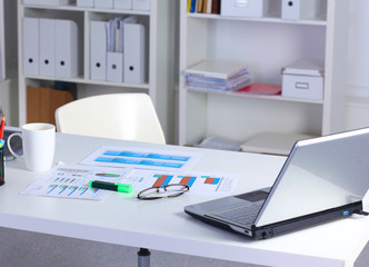 Office desk and a bundle of documents