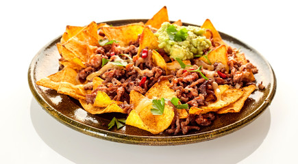 Round ceramic plate with chips, cheese and beef
