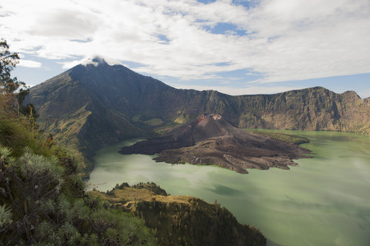 Scenic view of Mount Rinjani against cloudy sky at Lombok, Indonesia