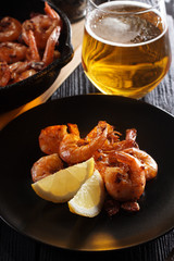 Fried shrimps with light beer glass