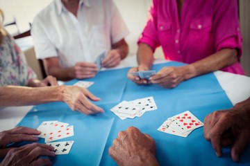 Group of seniors playing cards