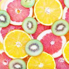 Fototapeta na wymiar Fruits background macro. Citrus fruits top view macro, selective focus.