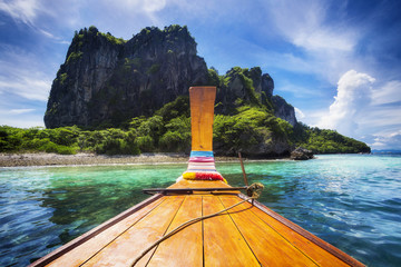 Naklejka premium Traditional longtail boat on the way to famous Maya Bay beach in Koh Phi Phi Island, Thailand.