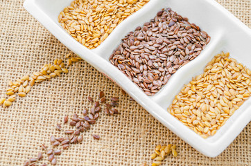 gold and brown linseeds or flax seeds.
