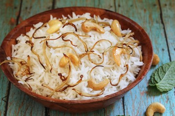 Ghee Rice / Nei choru - Rice cooked in clarified butter granished with fried onions and nuts
