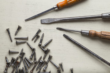 Construction tools set on wooden light background. Assortment instruments for repairman, carpenter, builder. Copy space for text. Top view. 