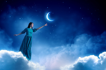 Fototapeta na wymiar Woman in night sky