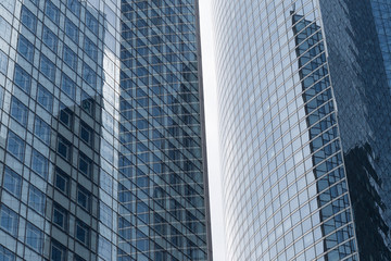 Skyscrapers with glass facade. Modern buildings in Paris business district. Concepts of economics, financial, future.  Copy space for text. Dynamic composition.