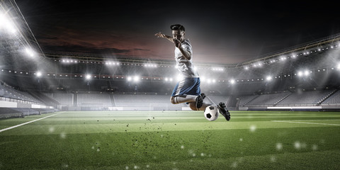 Soccer player hitting ball