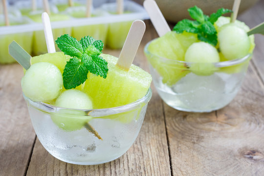 Homemade melon popsicles in the glass, closeup