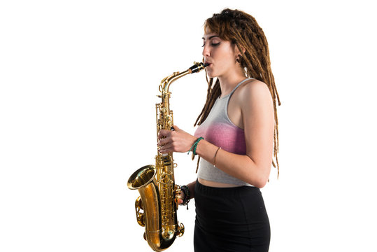 Girl with dreadlocks playing the saxophone