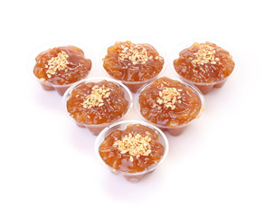 Triangle of group brown flavored sweet translucent gelatinous rice.