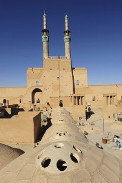 Iran, Yazd, back view of Zoroastrian complex of Amir Chakma with bazaar roofs