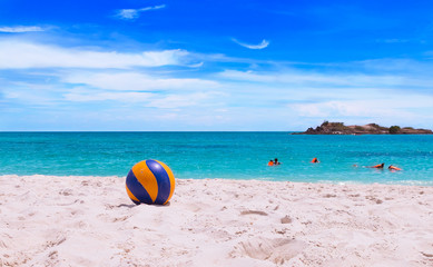 Fototapeta na wymiar Volleyball on beach with beautiful sea background, Beach ball.