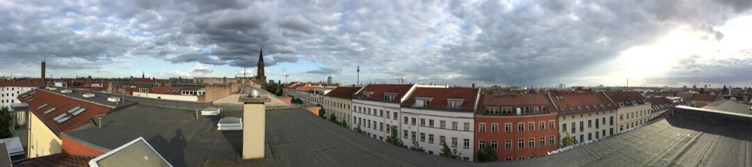 Fototapeta na wymiar Berlin Roofing Panorama with Clouds