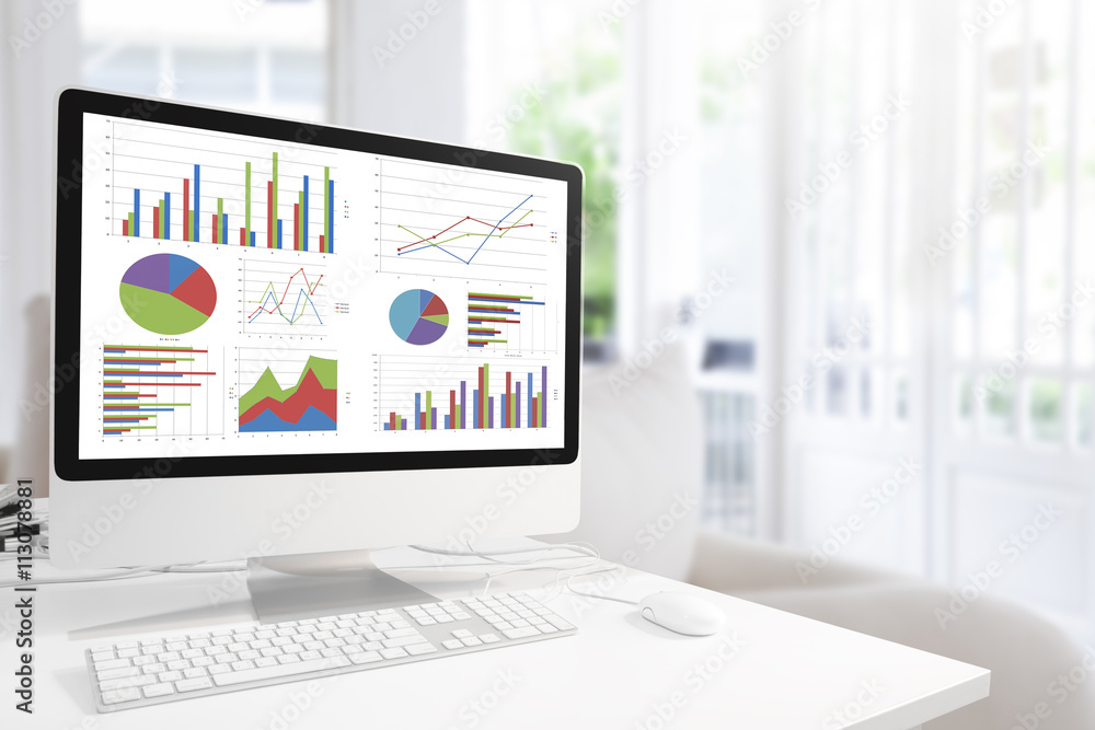 Poster Modern computer with keyboard and mouse on table showing charts