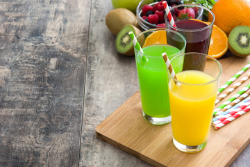 Fototapeta premium Fresh fruit smoothies on a rustic wooden table
