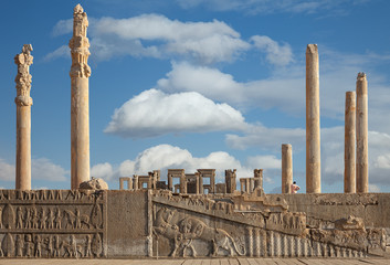 Ruins of Persepolis UNESCO World Heritage Site Against Cloudy Blue Sky in Shiraz City of Iran