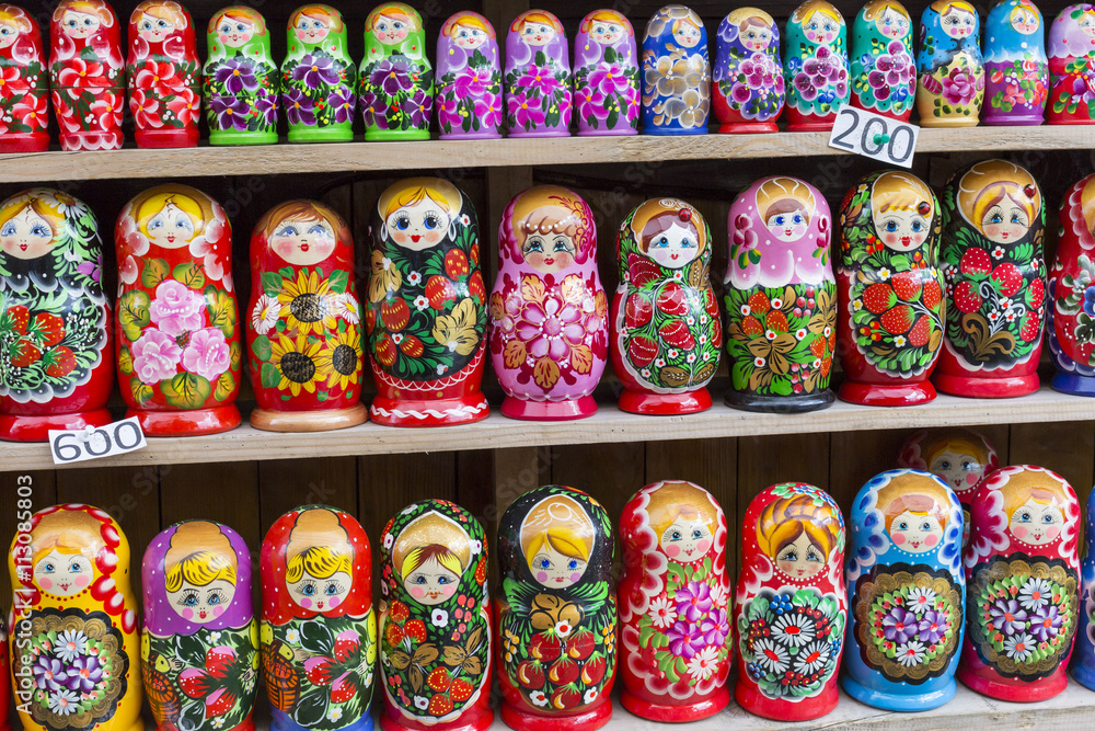 Wall mural Colorful Russian nesting dolls matreshka at the market. Matriosh