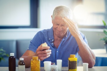 Senior man suffering from headache