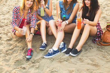 Girlfriends have fun and drink along the beach cocktails