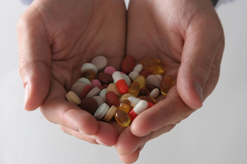 Hand holding a pills