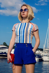 young business woman in short blue trunks