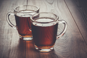 cups of tea on the wooden table