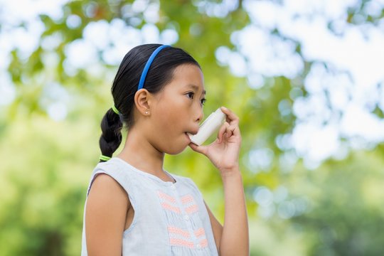 Girl Using An Asthma Inhaler