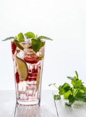 Homemade lemonade with strawberries, lime and mint