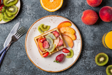 Breakfast waffles with fresh fruit.