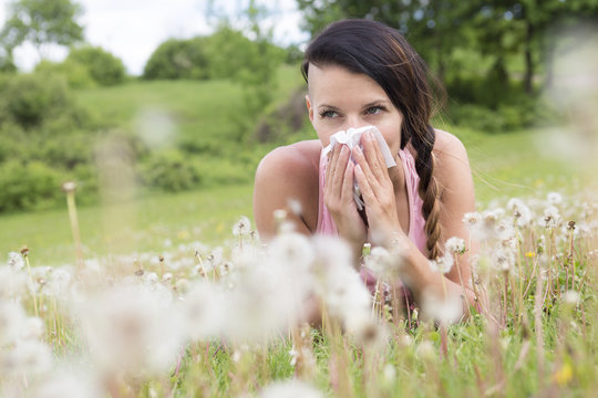 Young Woman Suffering Spring Pollen Allergy