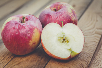 Naklejka na ściany i meble fresh red apples on the wooden table