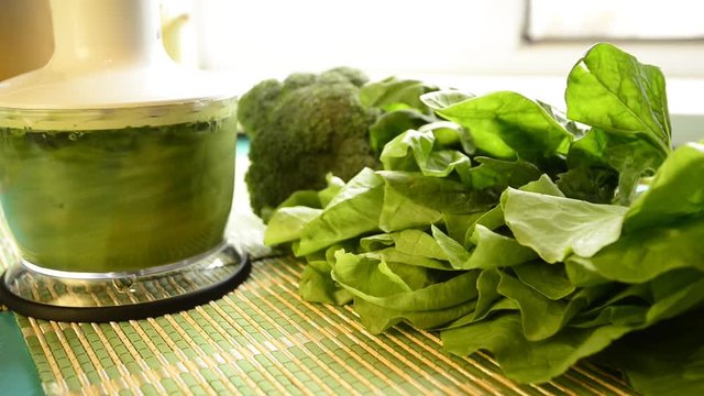 Cooking of green smoothie in a blender. Healthy eating, healthy lifestyle