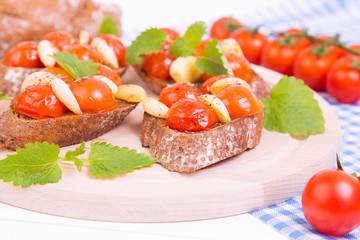 Classic italian bruschetta with tomatoes and garlic on a board