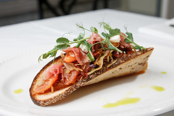 Cabbage snack with bacon on sour-sweet bread