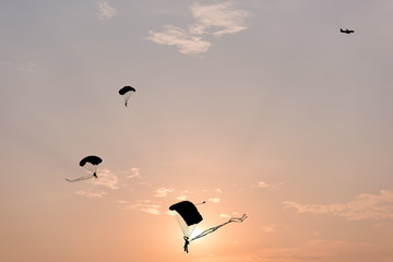 Parachute, Silhouette of parachute and airplane on sunset background