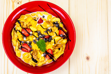 Cornflakes with Strawberry and Chocolate. Healthy Breakfast